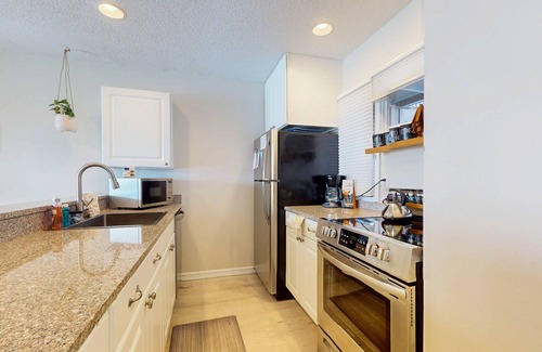 Maple City Condo | Riverview condo near the lake with beach access, fireplace, patio & cable