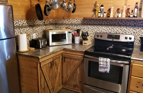 Woody Point House | Rustic Log Style Chalet in the Heart of Gros Morne National Park!