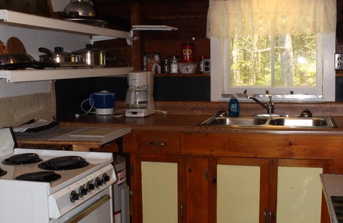 Dennysville Cottage | Rustic, two-story, clapboard cottage, field view, Pet-friendly, Downeast Maine