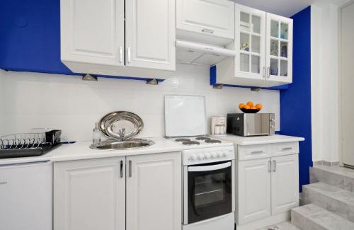 Mousio Apartment | Santorini Style in Athens, Greece