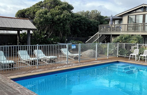 Waikanae House | SEABREEZE@Longshore: heated swimming pool, spa, tennis court, 2 minutes to beach