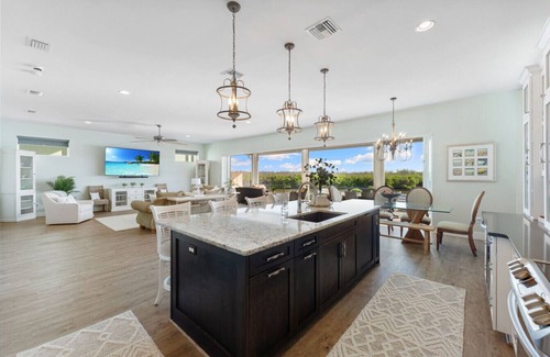 Bonita Springs House | Seafoam Serenity - Bayfront Retreat w/Dock, Pool & 1 Min Walk to Bonita Beach