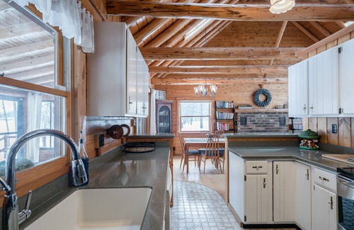 Big Rapids Cottage | Secluded Lakefront Log Home on 4 Acres With Sauna