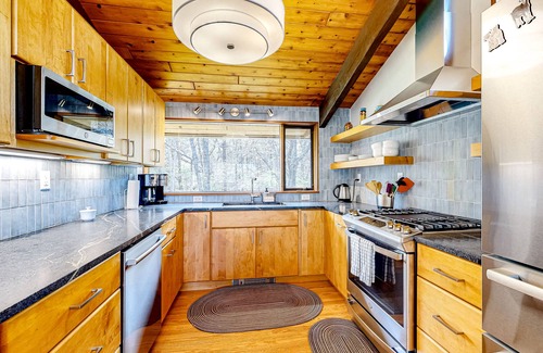 Chilmark House | Secluded mid-century home with wraparound deck, yard, grill, partial AC, & W/D