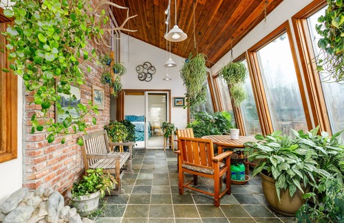 Rabbit Creek House | Secluded retreat with lush sunroom, scenic deck, fireplace & W/D