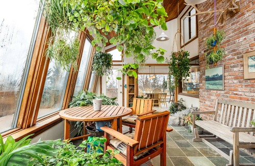 Rabbit Creek House | Secluded retreat with lush sunroom, scenic deck, fireplace & W/D