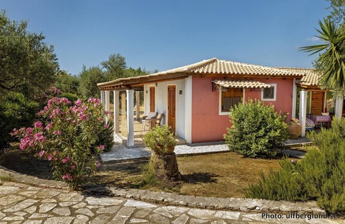 Vasilikos Cottage | Self catered cottage with large veranda and garden with hammock near the beach.