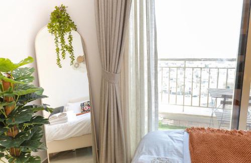 Jumeirah Village Circle Apartment | Serene studio apartment with Burj Khalifa view in Jumairah Village Circle JVC