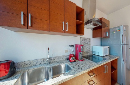 Zazil-ha Apartment | Serene vacation apartment with central AC, strong WiFi, & a shared rooftop pool
