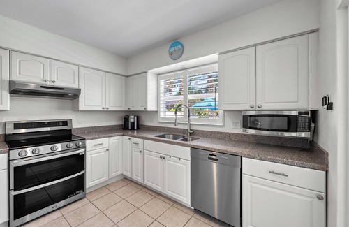 Siesta Key Village House | Siesta Key Waterfront Oasis - Heated Pool, Dock, Walk to Village & Beach