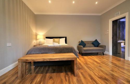 Airdrie Apartment | Signature - Linden Cottage Room 1