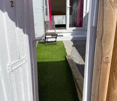 Paignton Apartment | SINGER SEWING MACHINES FORMER HOME ,FREE PARKING ,1 BEDROOM GROUND FLOOR HOLIDAY FLAT , Private Gate & Garden & Bathroom , microwave , Fridge , Opposite Paignton Pier & Beach , Hotel Reception To Happily Help & Greet you , 1 DOUBLE BED & 1 SINGLE BED