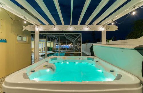 Palma Sola House | Sleeps 16 Heated Pool Hot Tub Fire Pit Putt Putt