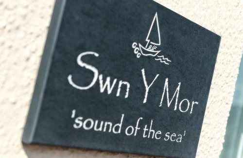 Tywyn House | Sound of the Sea, beach front Bungalow with hot tub, in Tywyn