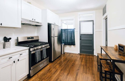Logan Square Apartment | Spacious 3-bedroom retreat in West Logan with modern amenities, perfect for families looking to relax and explore vibrant Logan Square.