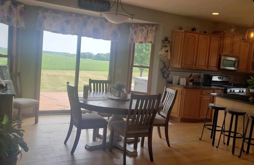 Pickett House | Spacious 4-bedroom with AC, fitness room, WiFi and manmade pond in Oshkosh.