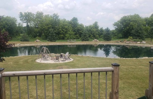 Pickett House | Spacious 4-bedroom with AC, fitness room, WiFi and manmade pond in Oshkosh.