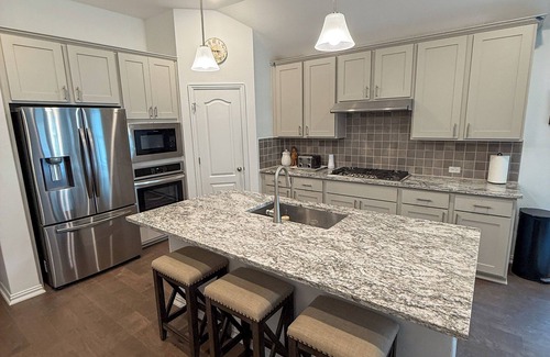 Buda House | Spacious 4BR Escape with Hot Tub, Laundry, and Pools in Buda.