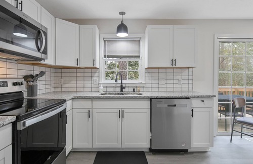 Terry Sanford House | Spacious Family Oasis with Hot Tub, PingPong, Air Hockey & More - Ideal Getaway!