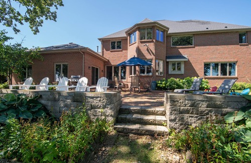 Oshkosh House | Spacious Home on the Water with Indoor Pool and Room For Everyone!