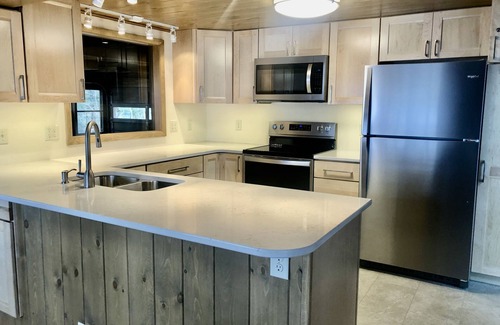 Interlochen Cabin | Spacious log home on Green Lake. Waterfront. Dog ok.