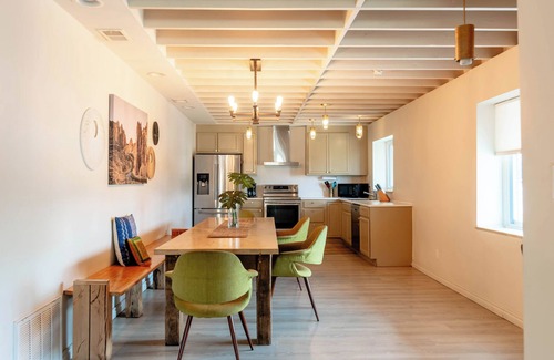 Roseville Apartment | Spacious modern loft with a city view.