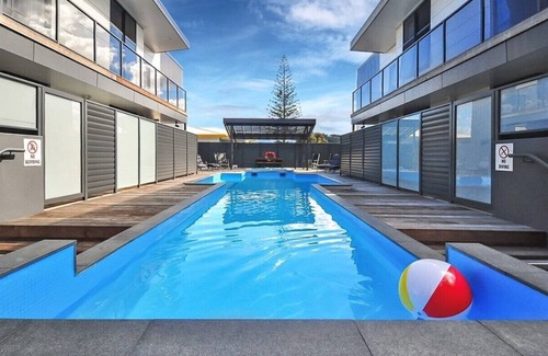 Whangamata Apartment | Spectacular Apartment with Spa pool, Heated Swimming pool, Private Decks & more!