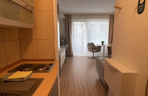 Leonberg Apartment | Studio with balcony and a sofa