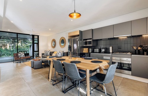 Salt Rock Apartment | Stylish Retreat, Forest, Braai & Back-up Power