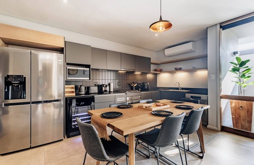 Salt Rock Apartment | Stylish Retreat, Forest, Braai & Back-up Power