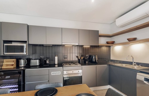 Salt Rock Apartment | Stylish Retreat, Forest, Braai & Back-up Power