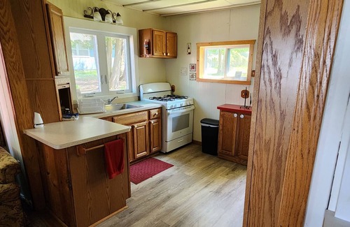 Cheboygan County Cottage | Sunset Shores 3 Bedroom 1 Bath Lakefront Burt Lake Cottage- Sleeps 6