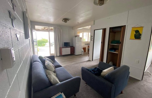Te Kouma House | Te Kouma, Coromandel. Steps away from safe swimming beach and fishing access.