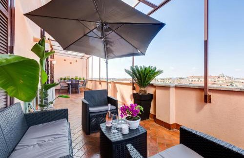 Rione XVI Ludovisi Apartment | Terrace with a view of Rome