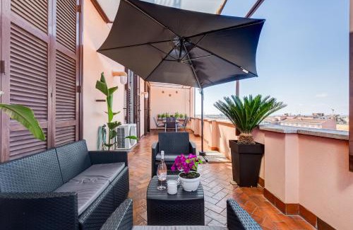 Rione XVI Ludovisi Apartment | Terrace with a view of Rome