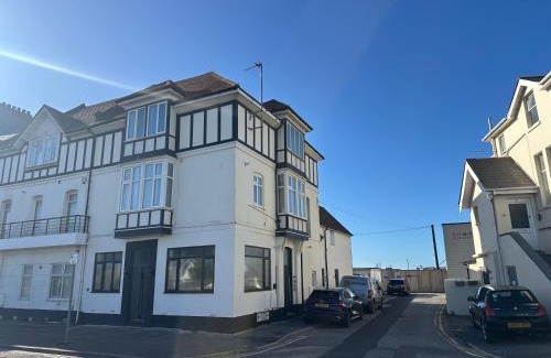 Southbourne Apartment | The Alice Apartment - by Coastline Retreats - Stunning Balcony Apartment with Sea Views - Alice in Wonderland Themed Secret Room - Luxury Copper Bath in Master Bedroom