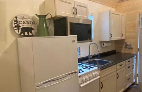 Old Mill Cabin | The Denali cabin, beautiful wood interior and vaulted ceilings.