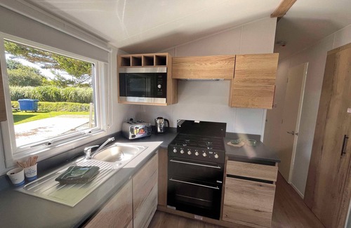 Newquay House | The Lucky Shamrock Caravan | Coastal Retreat | Family-friendly with playgrounds