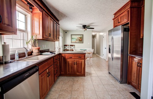Oakley House | The Pink House on Floyd - 3 bedroom with hot tub, large deck, and fenced yard.