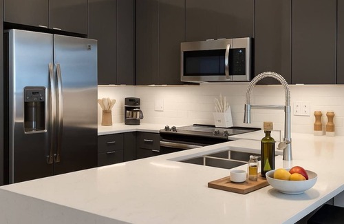 Downtown Dallas Apartment | The Red Room. Double King Bed. Grand Piano