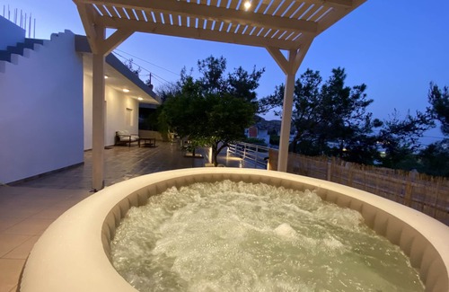 Stegna Apartment | Theros Luxury apartments - 5 minutes from the beach. Hot tub and BBQ facilities.