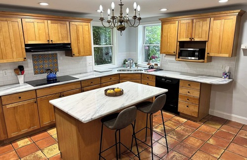 Bala-Cynwyd House | This 4 BR 4 BA sizable home with large outdoor porch & yard is ideal for a family visiting the area.