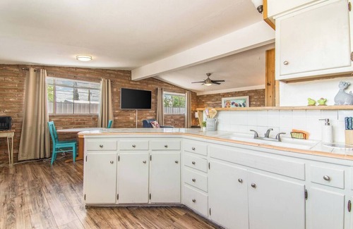 The Garden District Apartment | This centrally located 1 bedroom features a full size pool and electric vehicle charging on site.