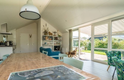 Westenschouwen House | This chalet has an extra spacious living room and two sitting areas, one of which is situated by the