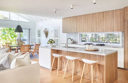 Palm Beach House | This home matches quaint beachside charm with luxurious comfort.