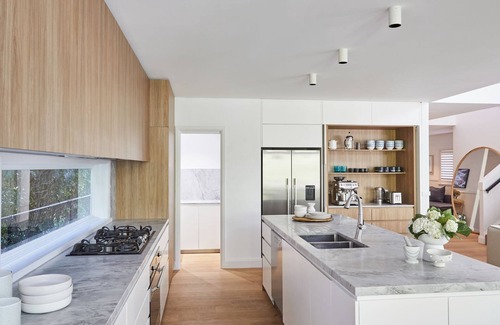 Palm Beach House | This home matches quaint beachside charm with luxurious comfort.