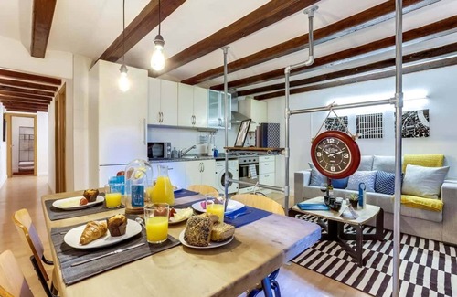 La Nova Esquerra de l'Eixample Apartment | This modern and thoughtfully designed loft combines industrial charm with warm, cozy comfort, creating the perfect atmosphere for a memorable stay.