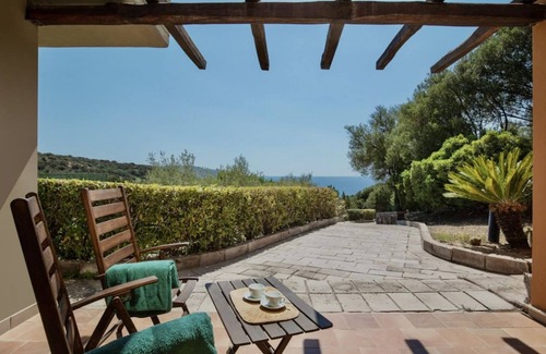 Teulada Apartment | Three-room apartment with sea view of approximately 62 m2 with air conditioning on the ground floor consisting of a large living room, kitchenette with electric hobs, fridge and TV.On the first floor we have two double or twin bedrooms with internal sink