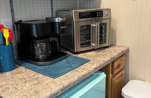 Marion Cabin | Tiny Cabin in the Laurels, with queen bed & queen sofa bed in wooded setting.