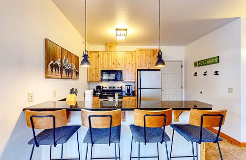 Whitefish Condo | Tranquil dog-friendly alpine retreat with fireplace & balcony - steps to slopes